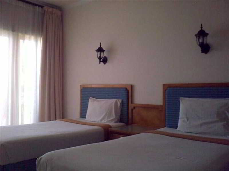 แปซิฟิค บีช คอตเทจ Hotel Mangsit ภายนอก รูปภาพ